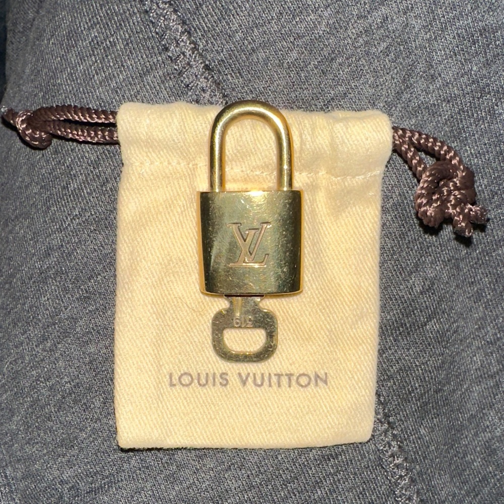 Louis Vuitton Gold Lock 319 with key and Cream Louis Vuitton Pouch